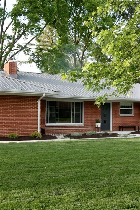 metal roof on off white brick ranch house|brick house metal roof ideas.